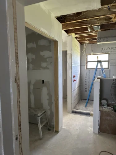 Bathroom and Shower During Remodeling Project Showing framing and new drywall