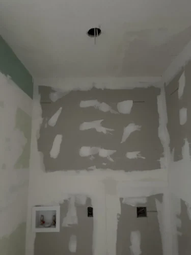 Laundry Utility Room Being Remodeled Showing New Plaster and Drywall
